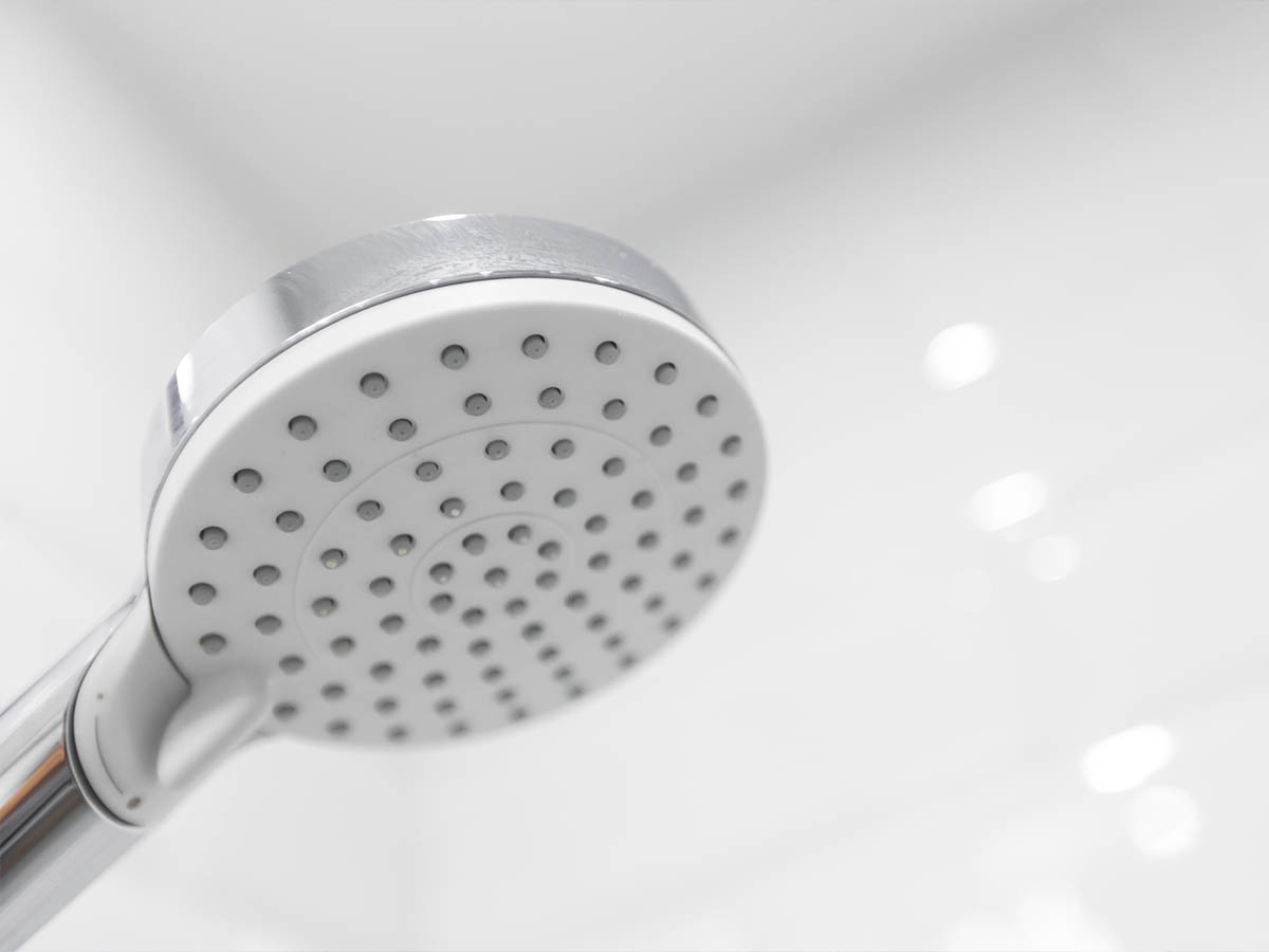 Plumber man with tools isolated over white background