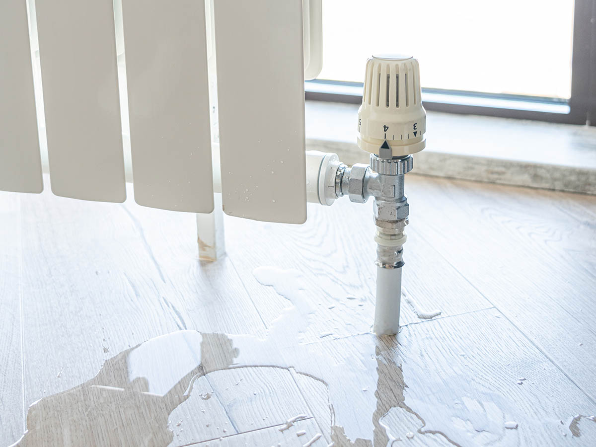 Plumber man with tools isolated over white background